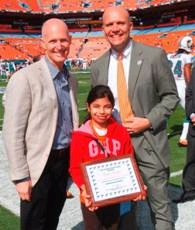 Amy Araya with Governor-elect Rick Scott (L) andMiami Dolphins CEO Mike Dee (R).
