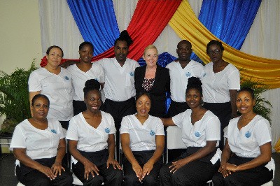 Front Row Seated: Left to Right – Charisse Pink, Verona Warburton, Shawnette Montaque, Marny Daley & Sharon Parris-Chambers. Second Row: Left to Right – Janice McLeod, Sanatta McLeggon, Lance Rose, ITEC Examiner, Dudley Malcolm & Audrey Bennett.