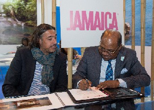 Edmund Bartlett signs an agreement with CEO of the Excellence Group Hotel, Antonio Montaner – Ferrer in Jamaica