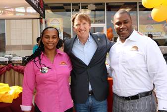 Jacqueline Hawthorne, Co-Founder of Golden Krust and Daren Hawthorne, Executive Vice President and Corporate Counsel pose with Andrew White, Candidate for Governor of Texas.