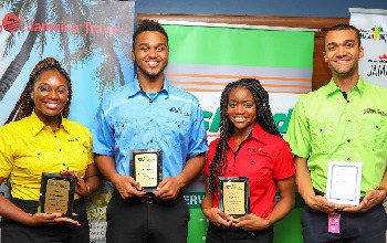 Smiles Jamaican Style! Smiles are definitely in order as the 2018 GraceKennedy Jamaican Birthright Interns happily display plaques they received on July 27 to commemorate the completion of their internship in Jamaica. From left are Anastacia Davis, Joshua Tulloch, Kayla Green and Keean Nembhard.
