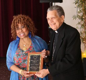 Partners of Good Shepherd Jamaica (POGS) Gressel Cathnott, receives award from Bishop Charles Dufour