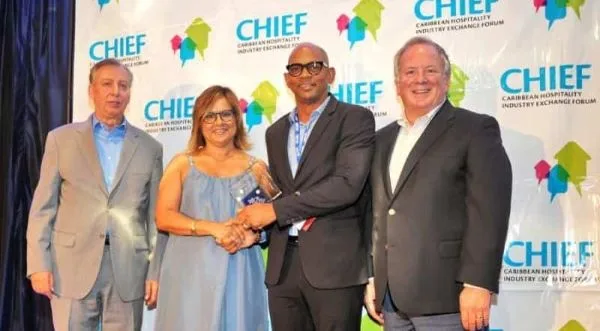CHIEF - Paul Collymore of The Landings Resort & Spa in St. Lucia is congratulated by (from left) CHTA's Frank Comito, Patricia Affonso-Dass and Bill Clegg.