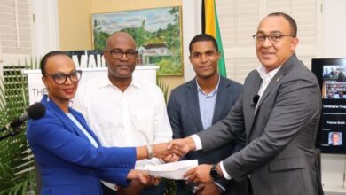 Dr. Jacqueline Watson, Richard Watson, Chad Price and Health and Wellness Minister Dr. Christopher Tufton. Health Clinics in Jamaica