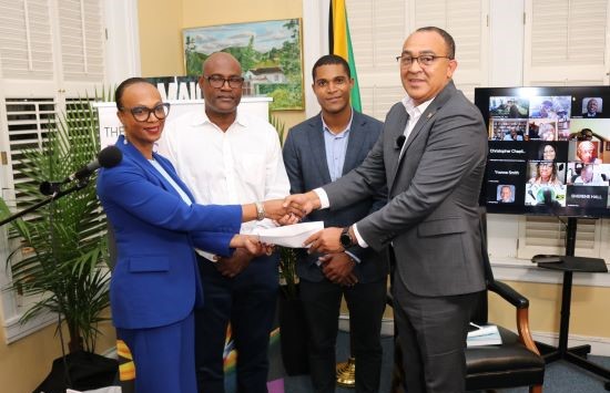 Donation for Health Clinics in Jamaica. Dr. Jacqueline Watson, Richard Watson, Chad Price and Health and Wellness Minister Dr. Christopher Tufton.