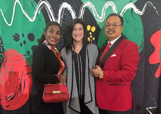 Audley Rollen, his wife Dawn Marie (left) and Tamarac mayor Michelle J. Gomez.